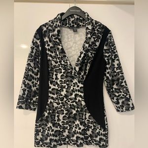Black/White/Gray animal print knit top with black side inserts for slimming fit.